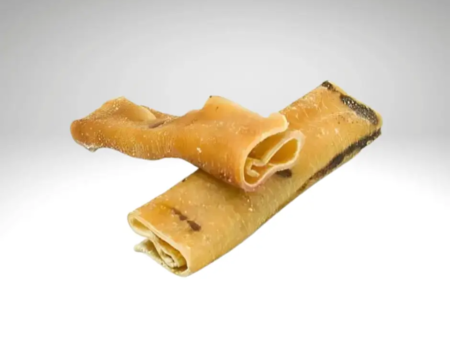 Two rolls of dried pigskin, golden beige in color, placed one on top of the other.